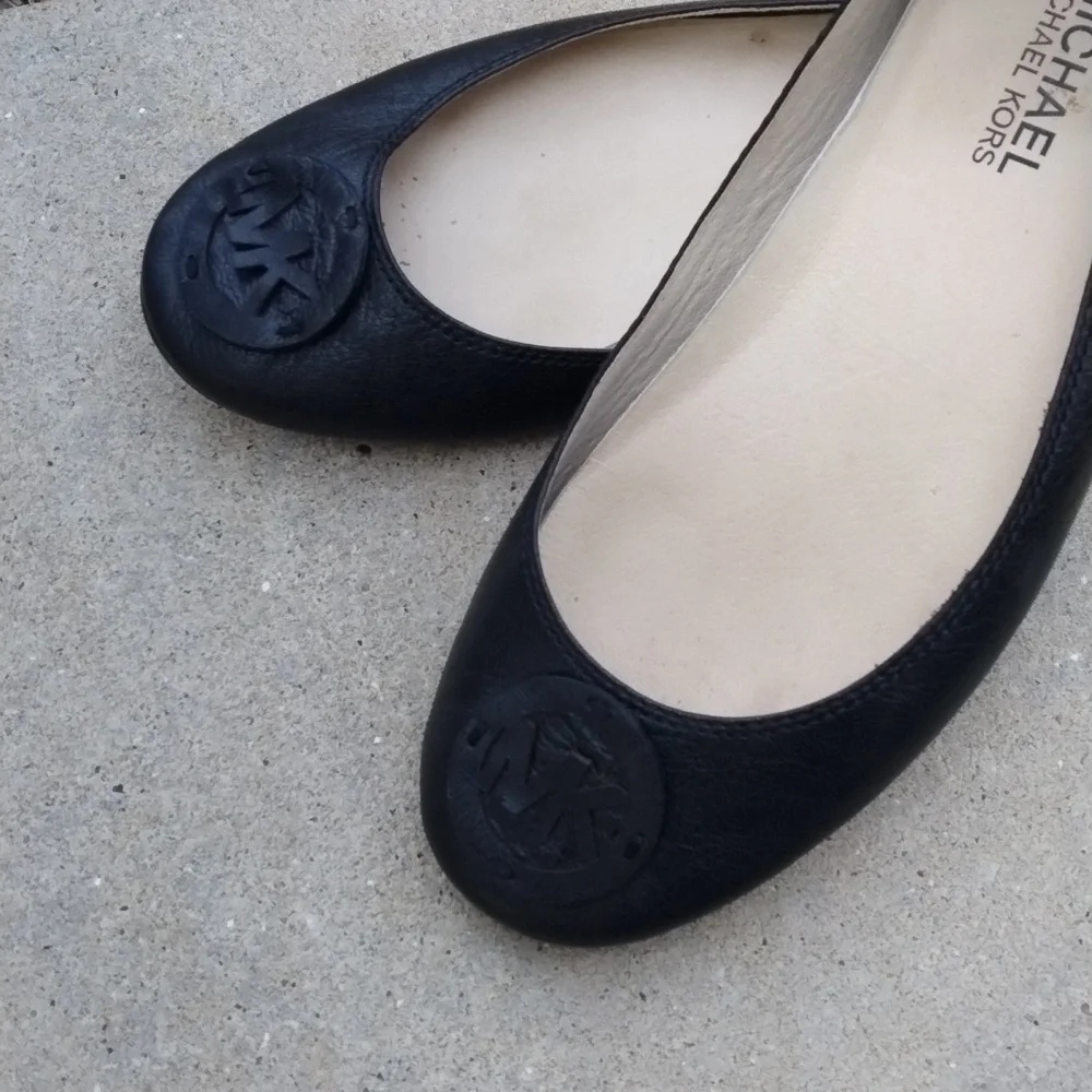 Michael Kors black leather flats with MK logo. Size 7.5